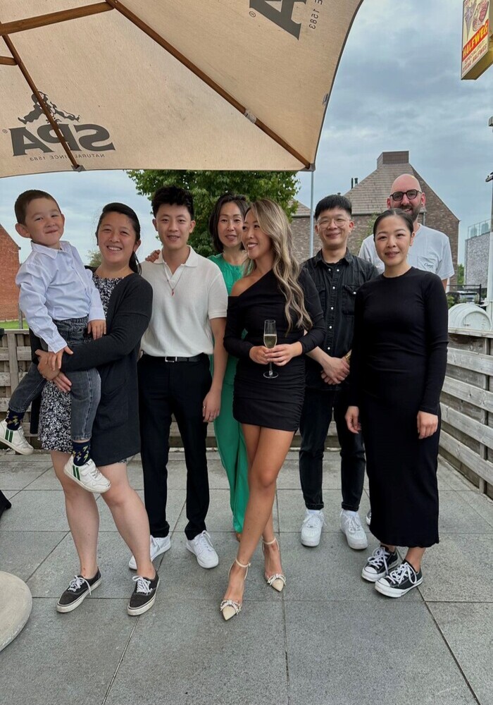 group photo of Qian's sisters, nephew and auntie taken during a family event